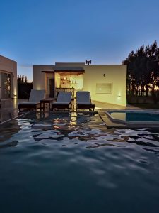 Property 1 a-house-with-a-swimming-pool-at-night-dsd6lgrnvbm